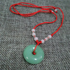 Graceful Jade Disc Pendant